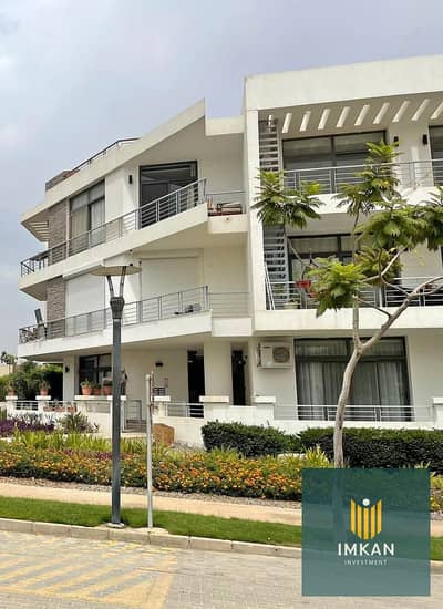 Apartment for sale with a 12-year installment plan and a 1.5% down payment in the "Origami Golf" phase of the Taj City compound—developed by Madinet M