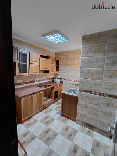 Apartment for rent in Green Compound 3, Sheikh Zayed, in front of Americana Plaza, with kitchen
