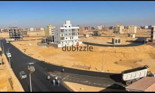 ارض للبيع التجمع الخامس بيت الوطن الحي الرابع فيلات م 657 موقع متميز على حديقه