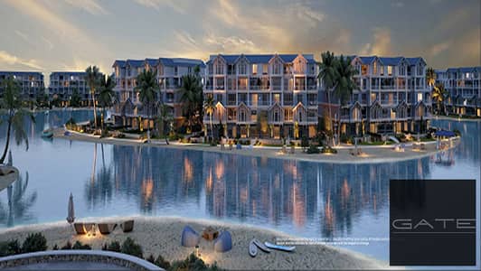 Ground-floor apartment with a garden for sale in Mountain View iCity October – Lagoon Phase (Resale) | Open view of the lagoon.