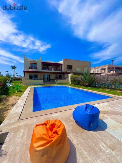 Available for rent, a villa with a private swimming pool, first line on the sandy lake, and it has a private umbrella over the sandy lake and a spacious garden with a total area of 2000 square meters