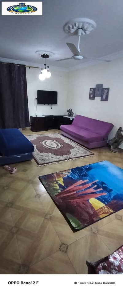 Furnished apartment for rent in Arab Maadi, distinguished location consisting of two bedrooms, reception, bathroom, and kitchen, tenth floor, elevator, close to the technology village, Al-Nasr Street, and the Olympic Club