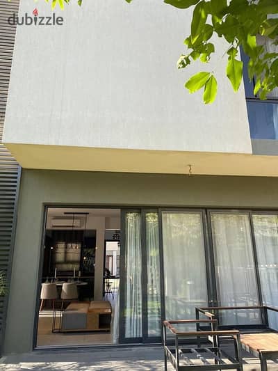 Fully finished duplex for sale in a prime location surrounded by amenities, with a distinctive landscaped layout.