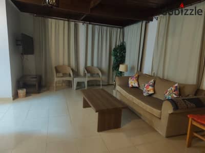 Furnished studio for rent in Yasmeen Compound, Sheikh Zayed, with room, bathroom, kitchen, living room, and large terrace of about 150 meters