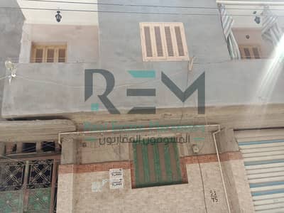 A two-story house for sale extending on Mohab Street at a very special price, and it has a finished apartment and a shop.