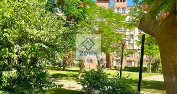 Apartment for sale on the ground floor with a garden in Madinaty, view wide garden steps from open air mall