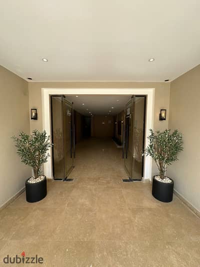 Apartment for sale directly from the owner, ground floor with garden, ultra-super-lux finished with air conditioning, in Village West compound by Dorr