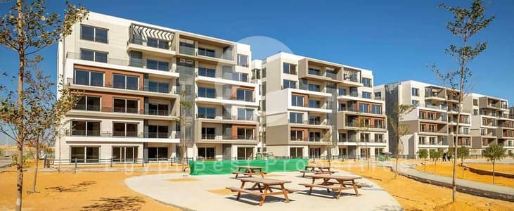 Own your ground apartment with garden with lowest price in Palm hills new cairo compound 5th settlement