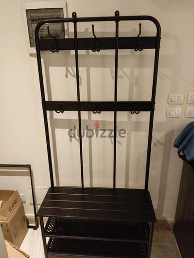 Black shoes and clothes rack