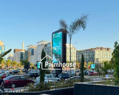 Commercial store for rent with a facade and corner on Al Bustan Street in the strongest location in Sheikh Zayed
