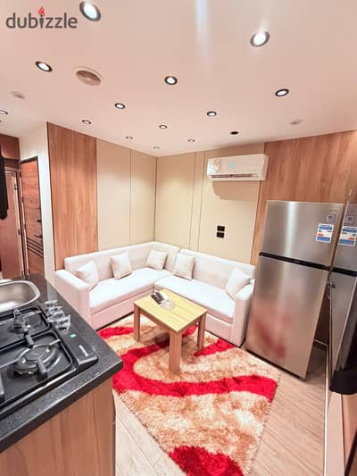 Two-bedroom apartment with a hall, bathroom, and hotel furnishings
