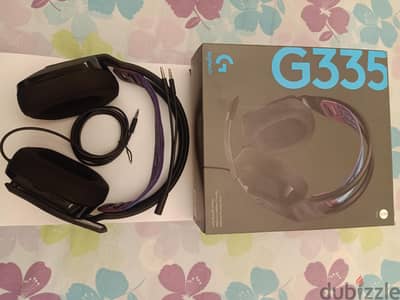 Logitech gaming headset model g335 with box and catalog with pc cable