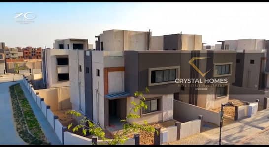 Villa for sale in a compound on Dahshour Road in front of Beverly Hills Zayed with installment directly from the owner in a luxurious compound
