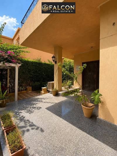 Townhouse villa for sale with a prime layout, located opposite the Madinaty gate and featuring views of the landscape and lakes.