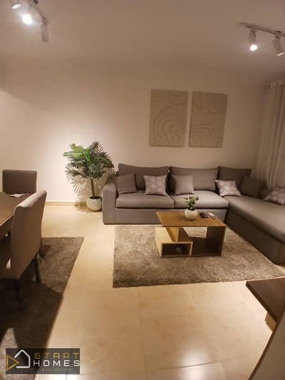 Furnished 74-square-meter, two-bedroom apartment for rent in Madinaty (B12); features custom finishes and views of the park and garden.
