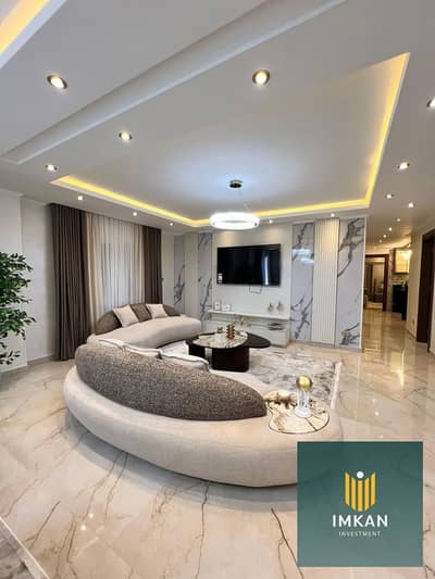 Fully finished, hotel-style furnished apartment for sale in the Amorada Compound, Fifth Settlement. It features a 110m² area, a private garage, and an