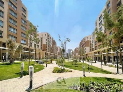 Apartment for sale in the capital in Al Maqsad compound next to the Green River and opposite the Iconic Tower | Only 5% down payment