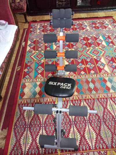 جهاز للبطن six back care