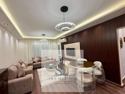 Furnished apartment for rent in Al-Rehab City, Phase 10, near Sayeda Aisha Mosque and the city administration. Modern furnishings, modern lighting, 3