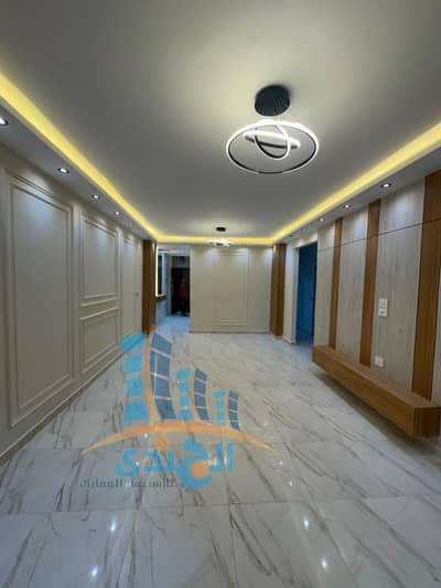 For sale in Al-Ahram Gardens, a front apartment with a balcony in the reception area, 145 facades equivalent to 160 m, a distinguished stone building with a distinctive entrance next to all services in the area.