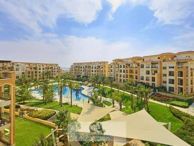 Apartment for sale ready to move in Stone Residence compound with a 25% cash discount in Fifth Settlement with a landscape view in new Cairo