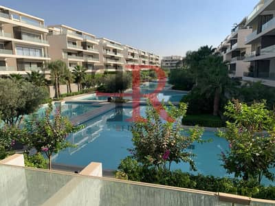 Apartment for rent semi furnished direct on lake  with  kitchen & Acs in lake view residence compound