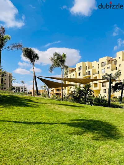 Luxury apartment for sale, fully finished, in O West Compound by Orascom, in a prime location with near-term occupancy and installment payment options
