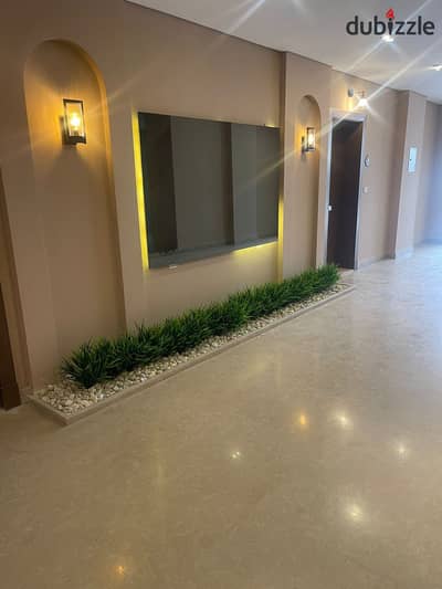 Ground floor apartment with a garden of 177 m in Village West Compound - fully finished with air conditioners - resale with installments at a very spe