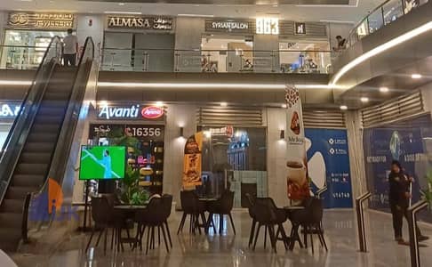 Commercial shop for sale, ready for immediate occupancy, currently rented for 72,000 EGP per month, in the heart of Fifth Settlement, New Cairo.