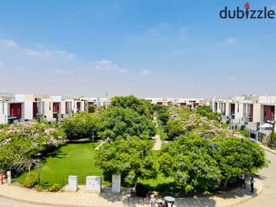 Terrace, Nasiya, and Ali, a wide garden view, unique modern villa for sale in Madinaty, 256 meters