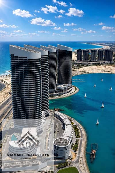 Hotel apartment in Al Alamein Towers with Panoramic sea&lagoon views at price lower than market value Finished VIP Over 12Years Steps from THE G Hotel