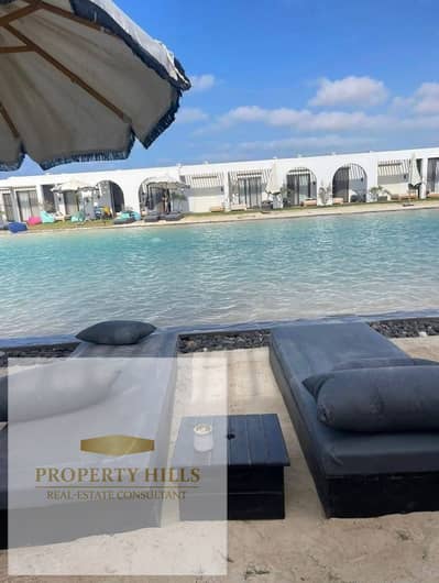 Chalet with a garden for sale, 5% down payment, first row by the sea, finished with air conditioning and kitchen in Palm Hills Hacienda Ras El Hikma - North Coast