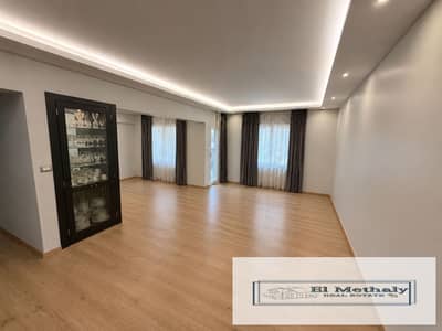 Freehold apartment for sale in Al Rehab City, New Cairo; fully custom-finished.