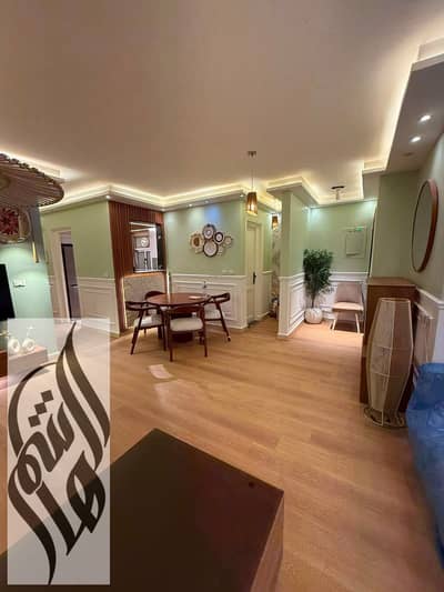 Luxury 116 sqm hotel apartment for rent in Madinaty. First occupancy, 3 bedrooms, 2 bathrooms, ground floor with garden view.