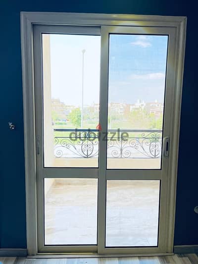باب بلكونة الوميتال جرار مع ضلفة سلك