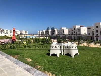 Ground-floor 2-bedroom chalet with a premium garden for sale in one of the best locations in Amwaj North Coast, featuring a great location and a speci