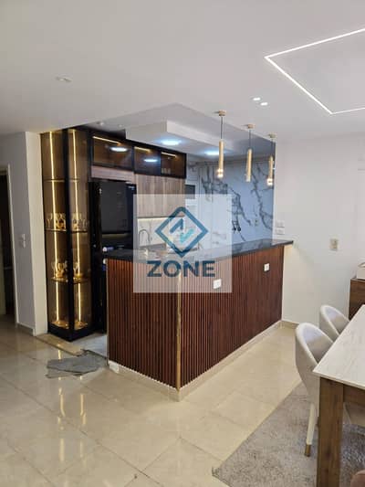 In Madinaty, an apartment for rent, new law, area of ​​​​115 square meters + garden, 40 square meters, with a garden view, minutes from the Strip Mall