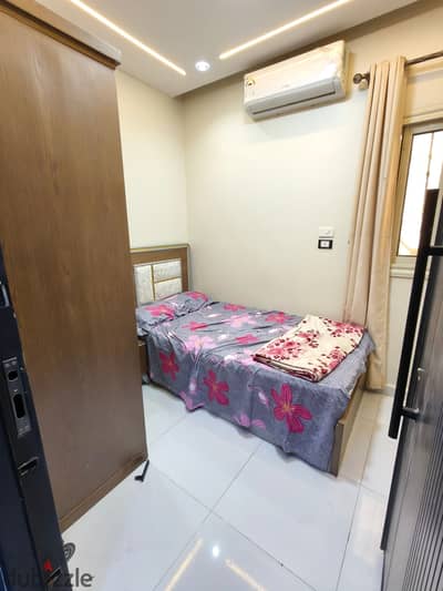 Studio single available for rent in 6th of October City, First District, First Neighborhood, elevated ground floor, inclusive of water and electricity, meter installation steps, Al-Hosary Mosque, close to all amenities, clean furnishing