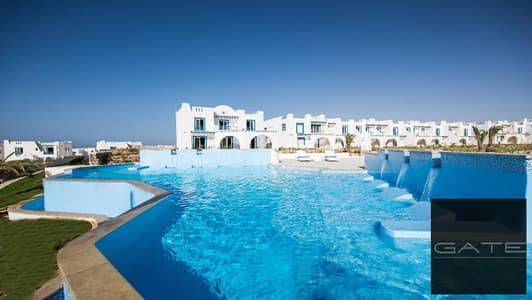 Resale – For sale: lowest price middle townhouse with immediate delivery and a swimming pool view in Mountain View Ras El Hekma.