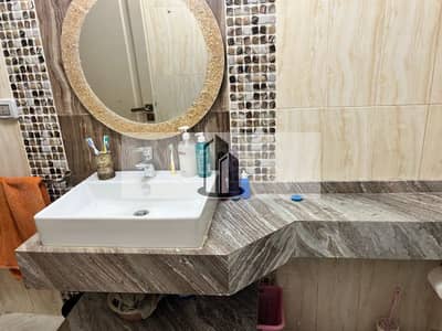 Ground floor apartment for immediate occupancy, ready for sale in Madinaty, B10.