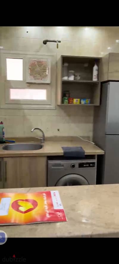 100-square-meter apartment for rent in Al-Ashrafiya Compound, First Settlement, New Cairo.