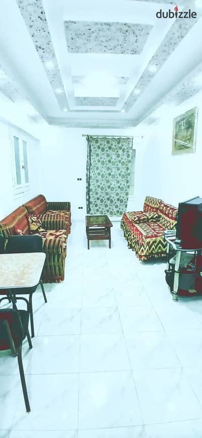 Apartment with furniture and appliances for sale in Al-Ajami, Al-Nakheel Beach, next to the Air Defense House, just a few steps from the sea, finishing in Lux style