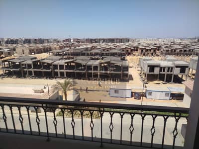Apartment for rent in Sheikh Zayed, Village West Compound, first occupancy, 3 bedrooms, 4th floor (one floor below the top), sea view overlooking vill