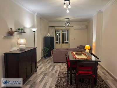 Furnished 100 sq m apartment for rent in Al Rehab, Block 100, near services and main roads.