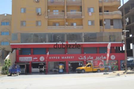 For rent in Hadayek Al-Ahram: a prime 65 sqm commercial unit. It features high-end ("Super Lux") finishing and has never been used. The unit includes