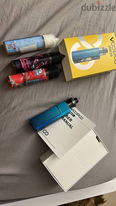 Voopoo Drag X3 vape mod with battery and 3 liquid
