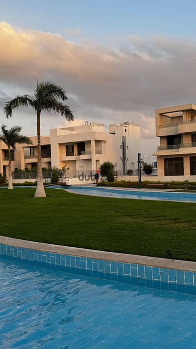 townhouse villa with immediate delivery for sale, overlooking a landscaped view in Lake West Compound, opposite Beverly Hills, Sheikh Zayed.
