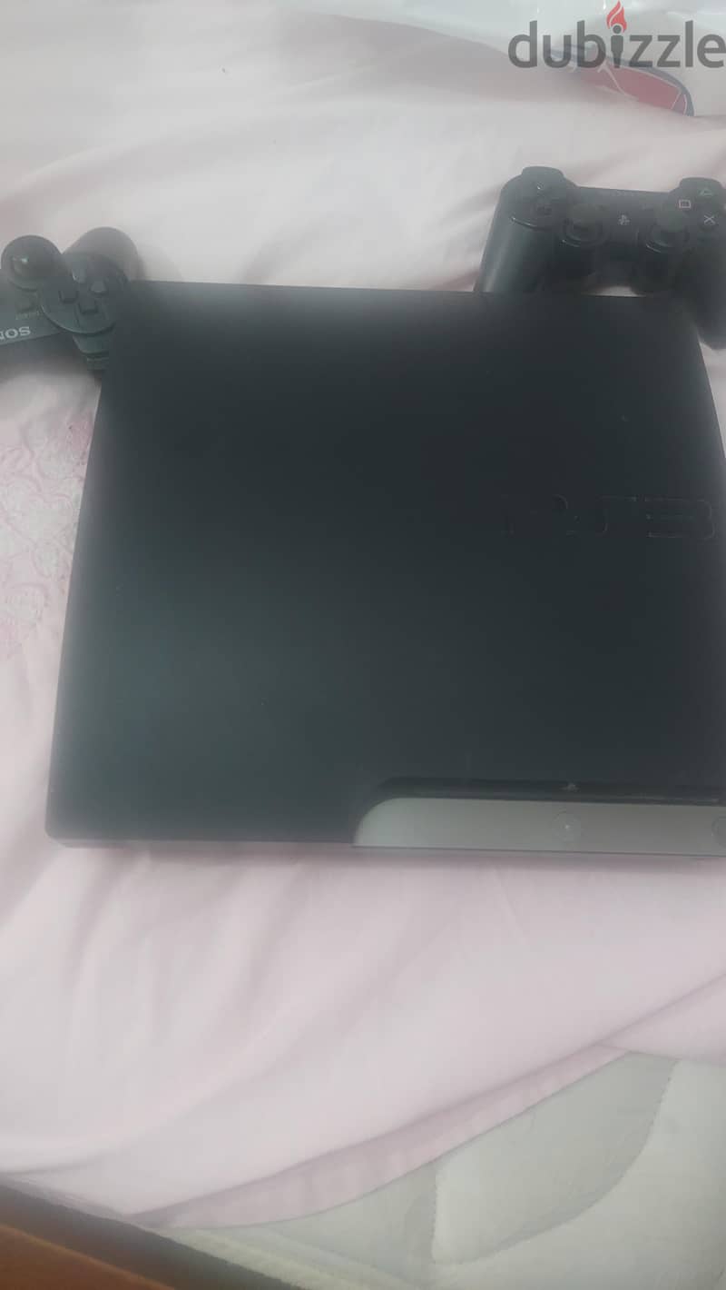 PlayStation 3 with 2 controllers 1