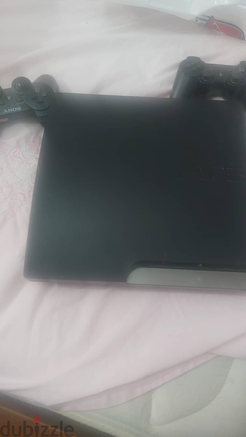 PlayStation 3 with 2 controllers 2