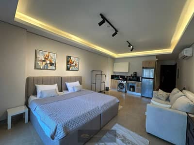 Luxury furnished studio for rent in ZED Compound - Sheikh Zayed, fully furnished with high-end finishes and modern furniture, ready for immediate occupancy, and featuring a strategic location within the project